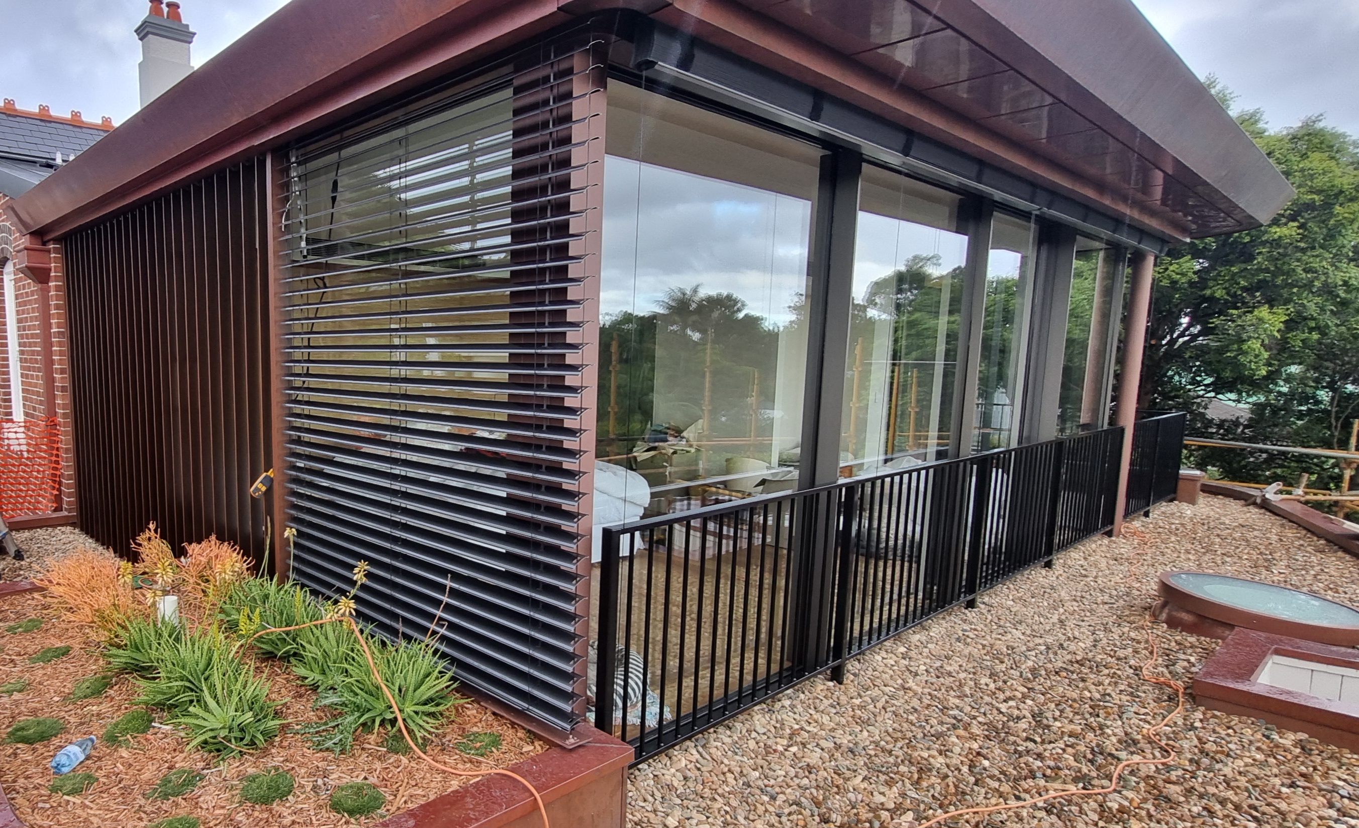 External venetian blinds on an architectural Sydney home façade — Shutters of Sydney