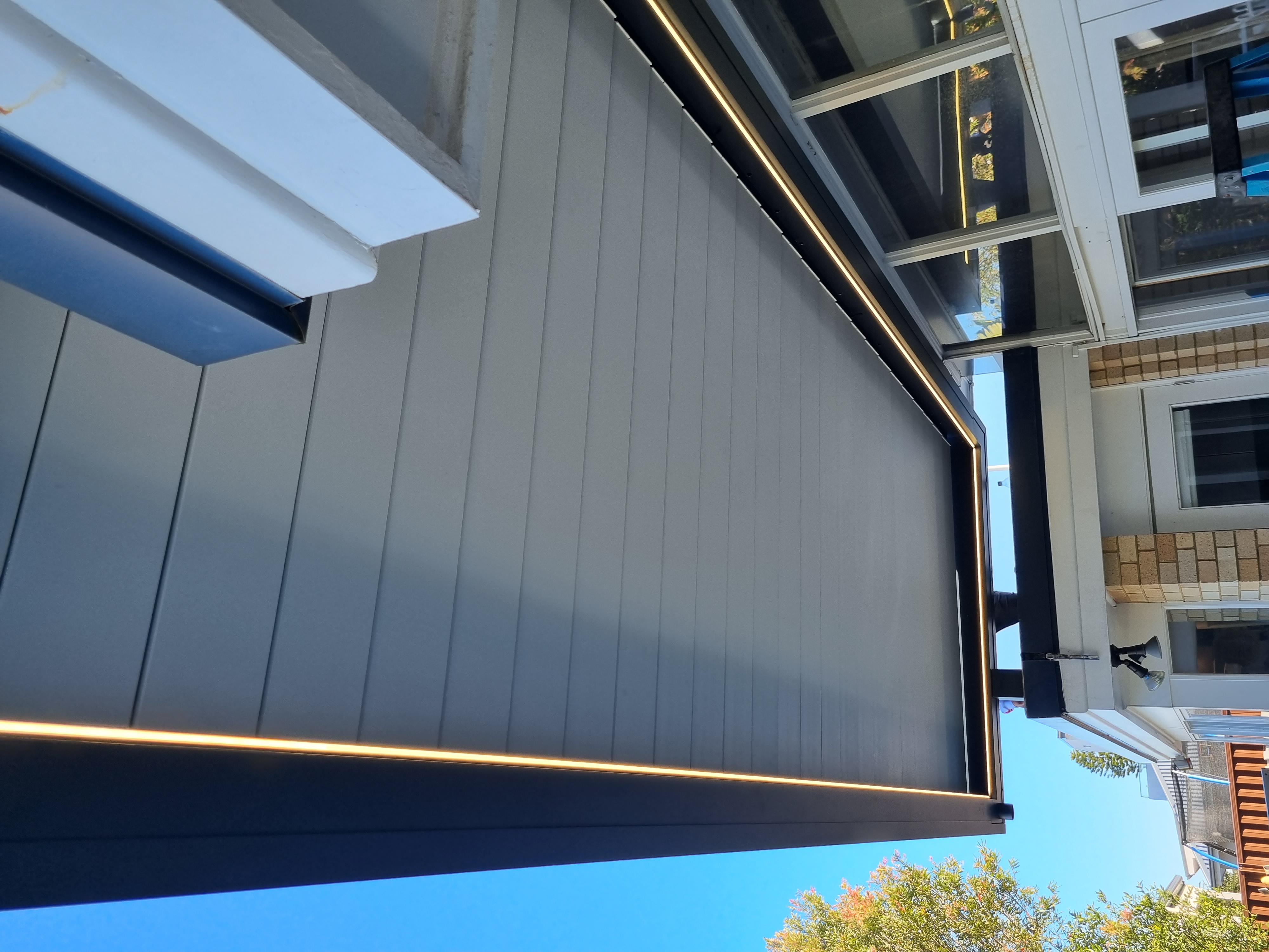 Motorised louvre roof with LED lighting on a Sydney residential property — Shutters of Sydney