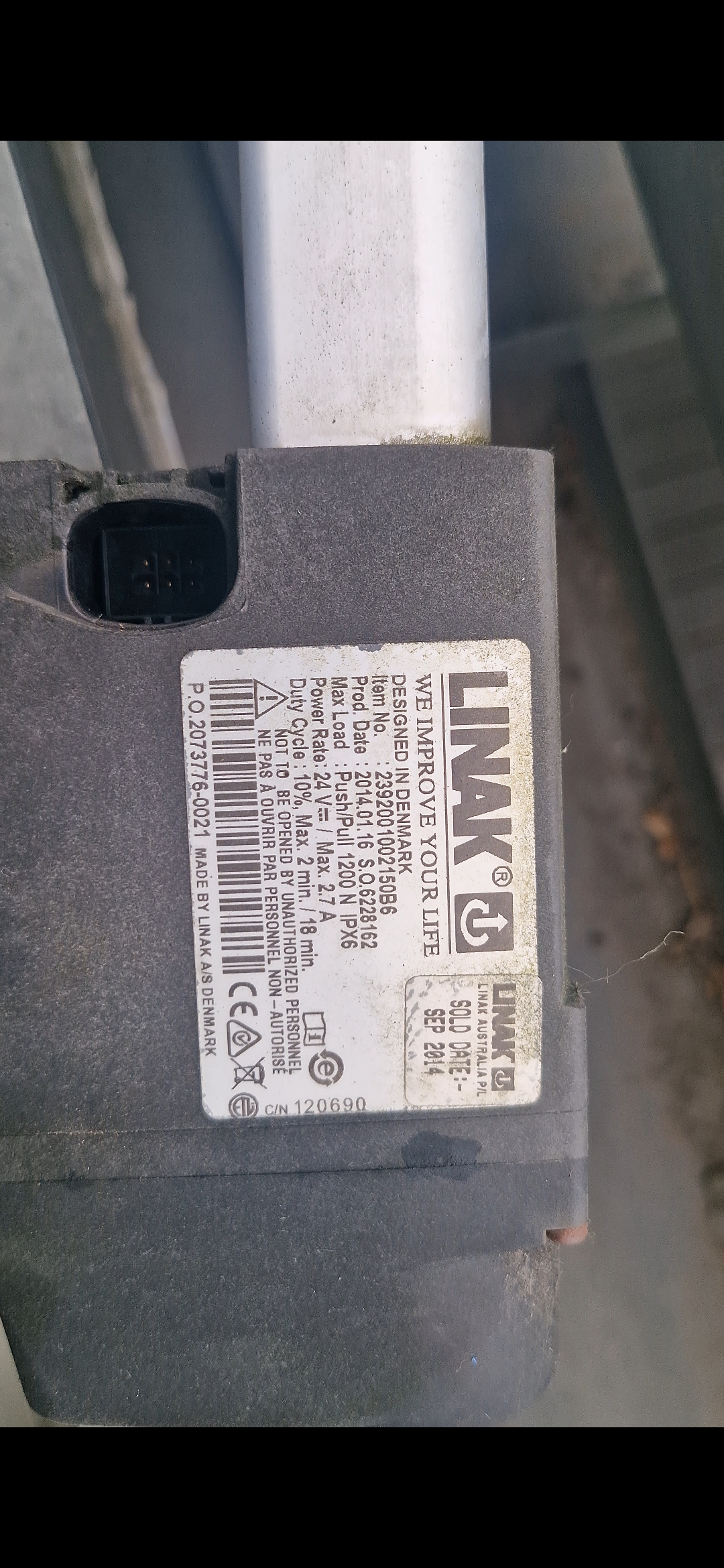 Linak actuator on a motorised louvre roof system under inspection — Shutters of Sydney