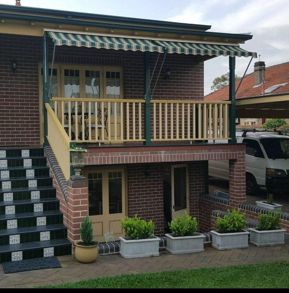 Residential folding arm awning on a Sydney home — Shutters of Sydney awning repairs