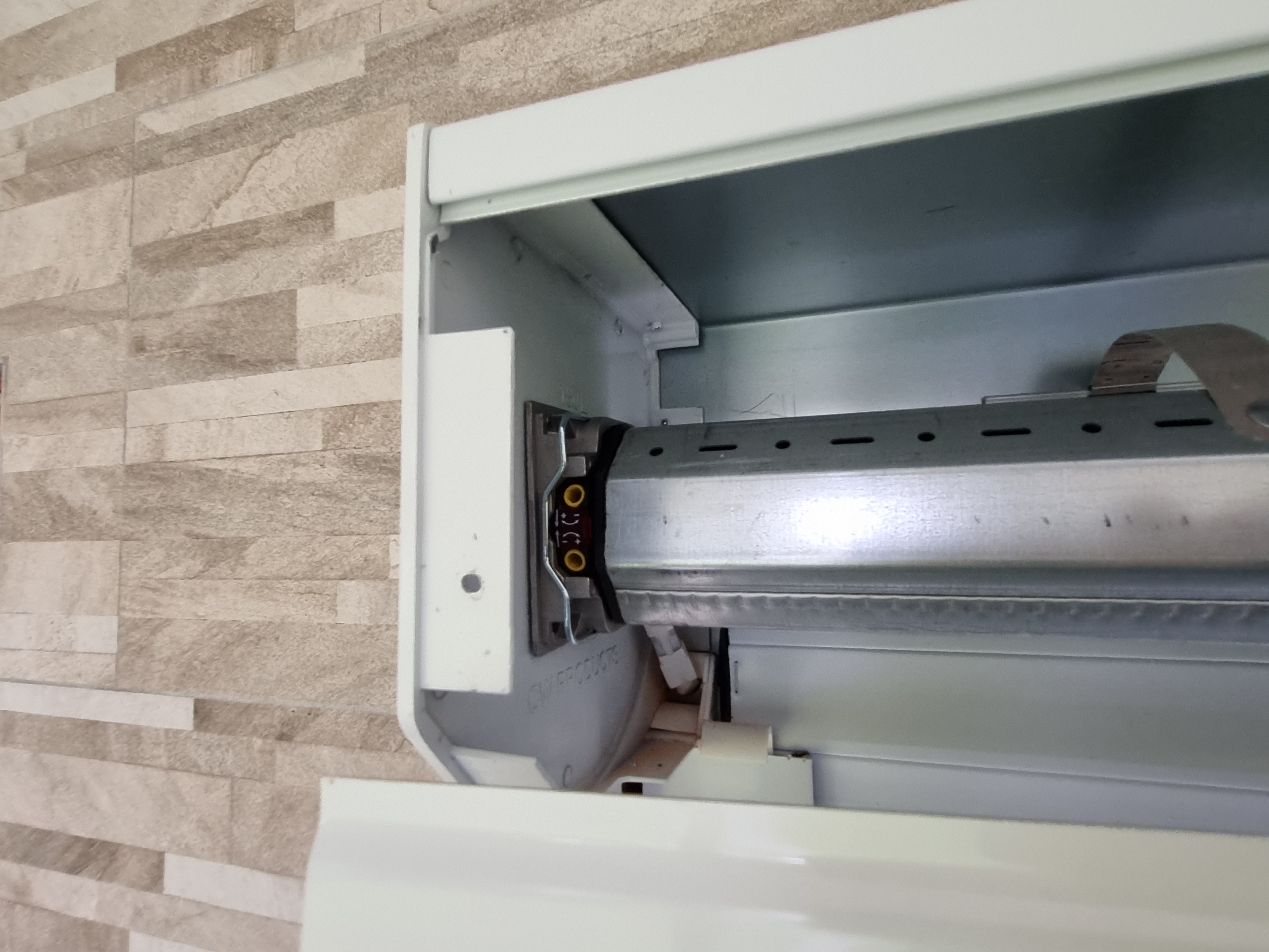 Open roller shutter pelmet showing motor and drive components — Shutters of Sydney diagnostics
