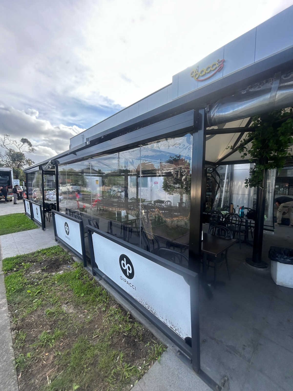 Commercial outdoor blind enclosure at a Sydney café — Shutters of Sydney