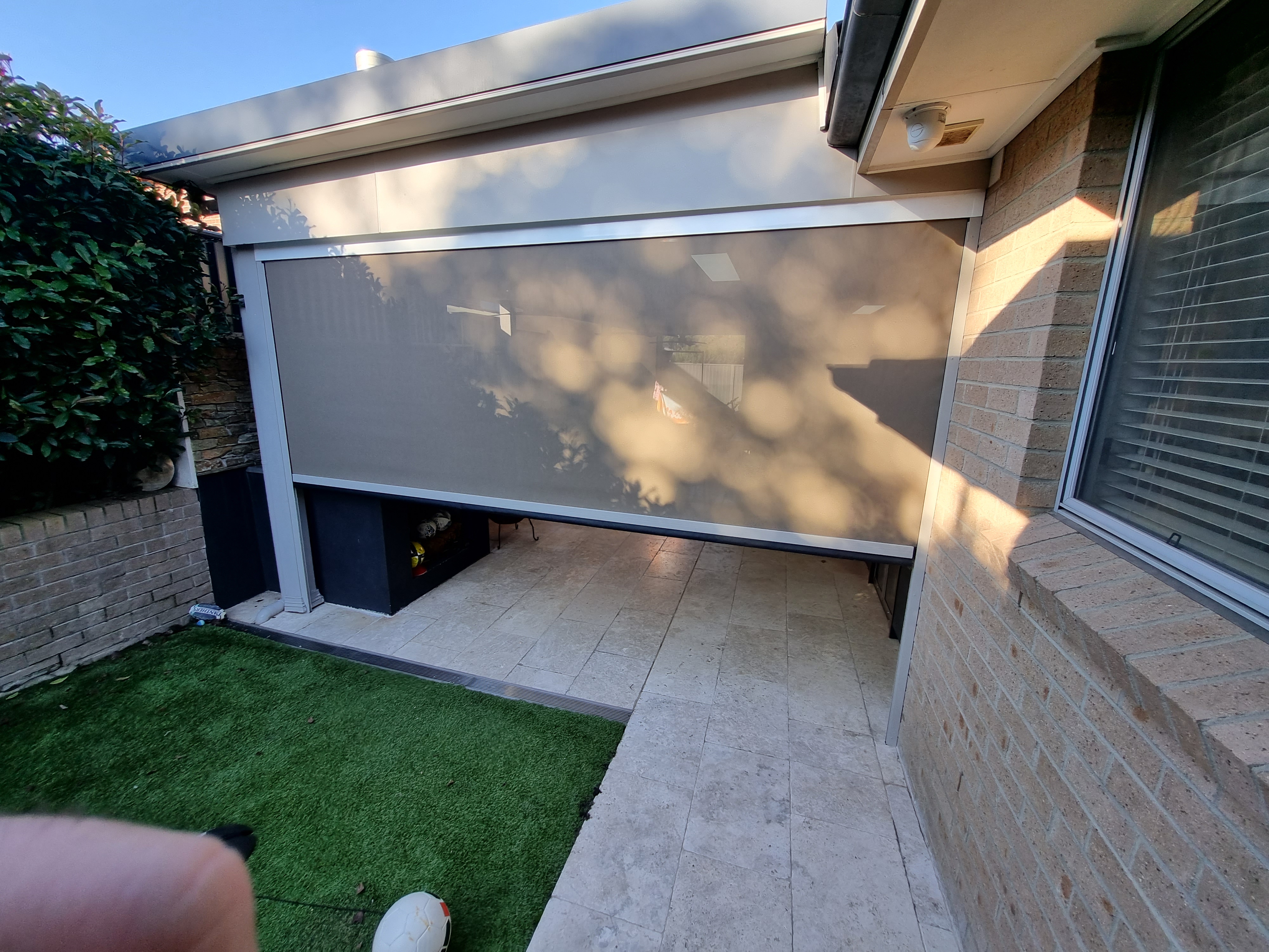 Zip blind outdoor blinds enclosing a residential Sydney alfresco — Shutters of Sydney